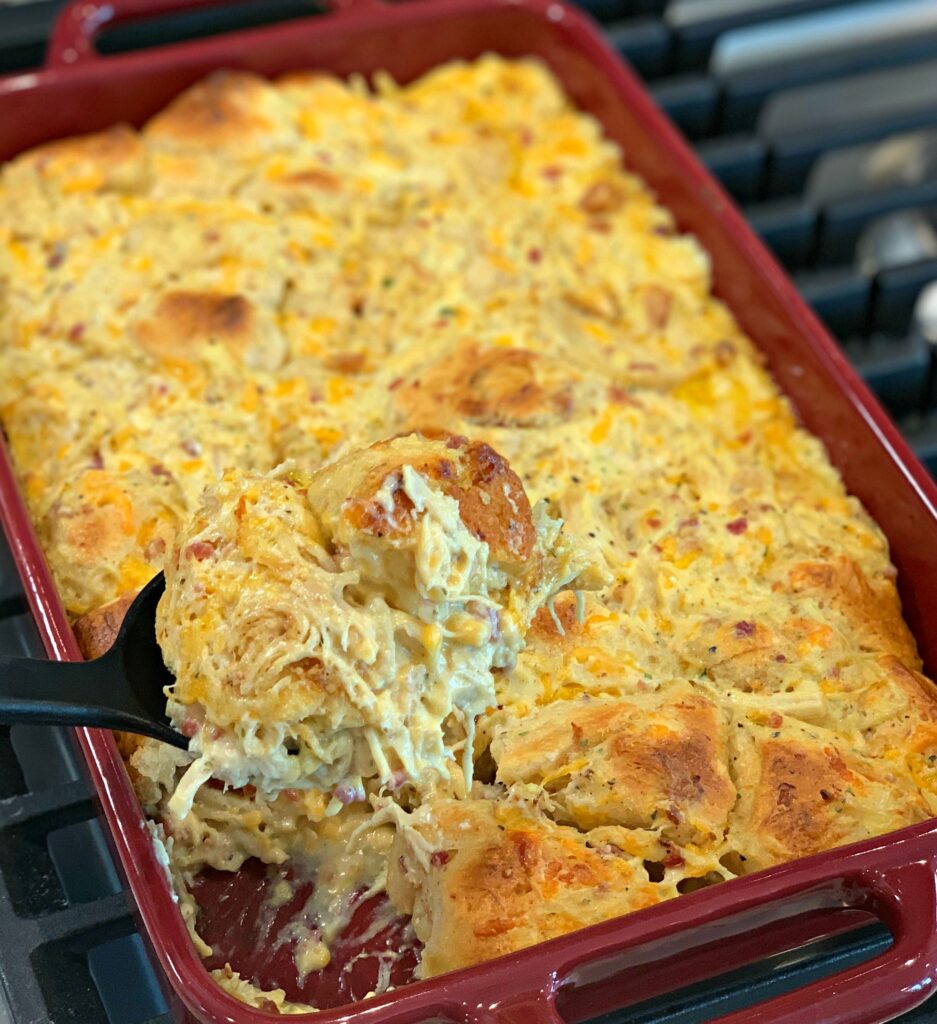 Shredded chicken, biscuits, cheese, and bacon combine into a flavorful casserole