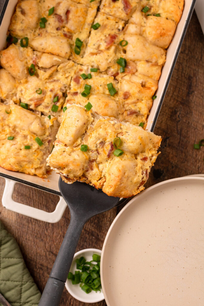 a slice of chicken biscuit bake ready to serve.