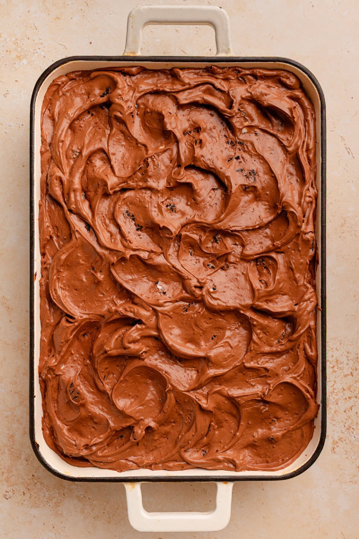 Chocolate pudding mixture spread on top of chocolate cake to make an Oreo Dirt Cake.