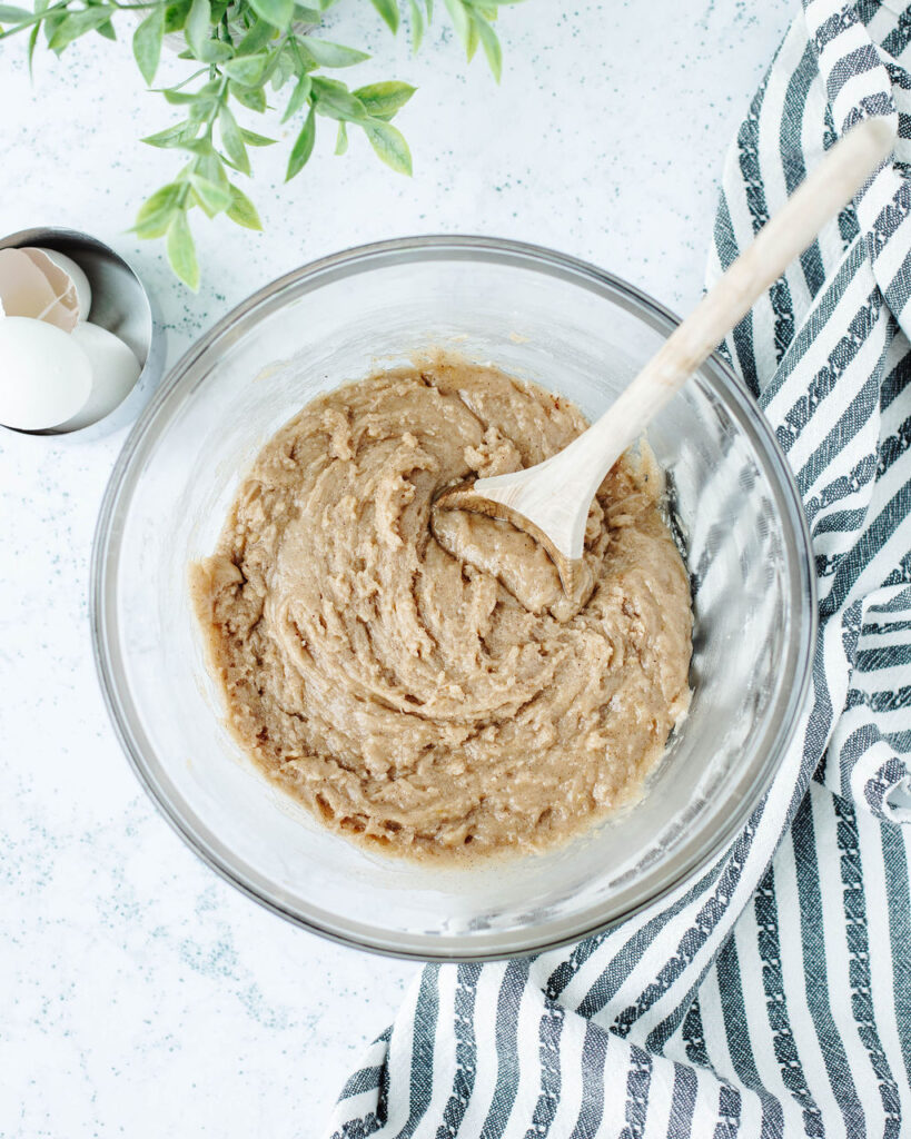 zucchini bread batter combined in a mixing bowl.