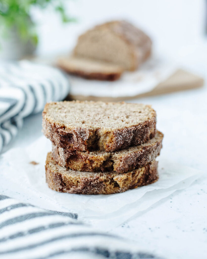 a stack of zucchini bread with a cinnamon sugar topping.