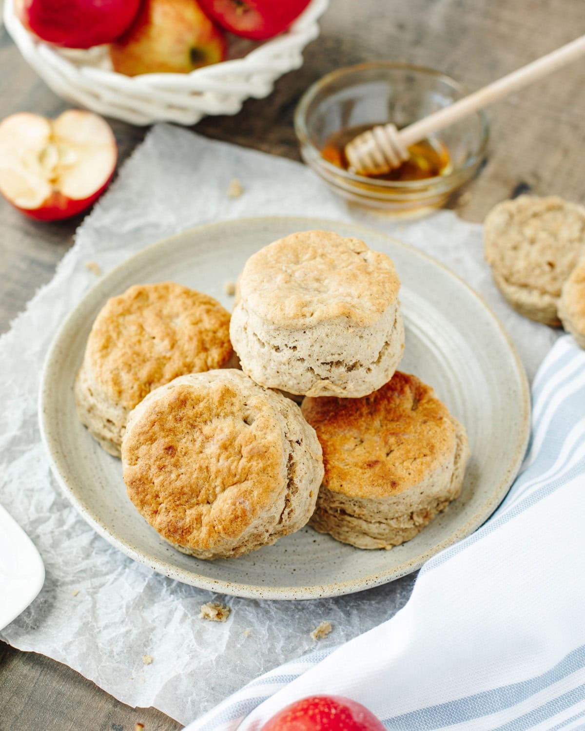 fluffy apple biscuits from scratch stacked on a serving plate.