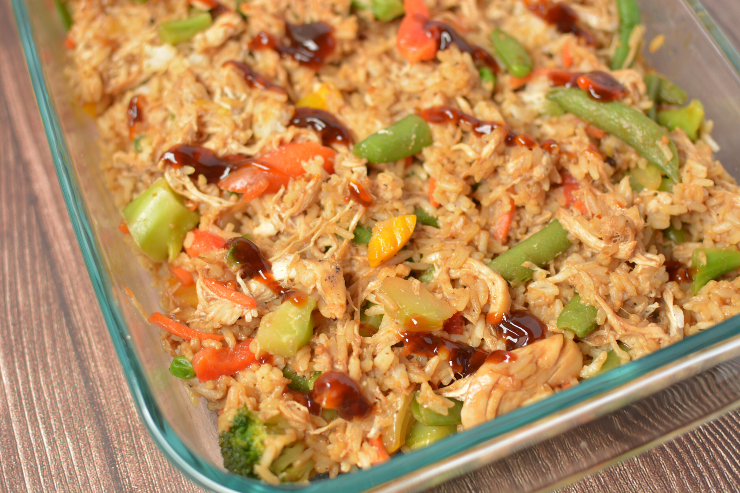 chicken teriyaki casserole with rice baked in a glass baking dish.