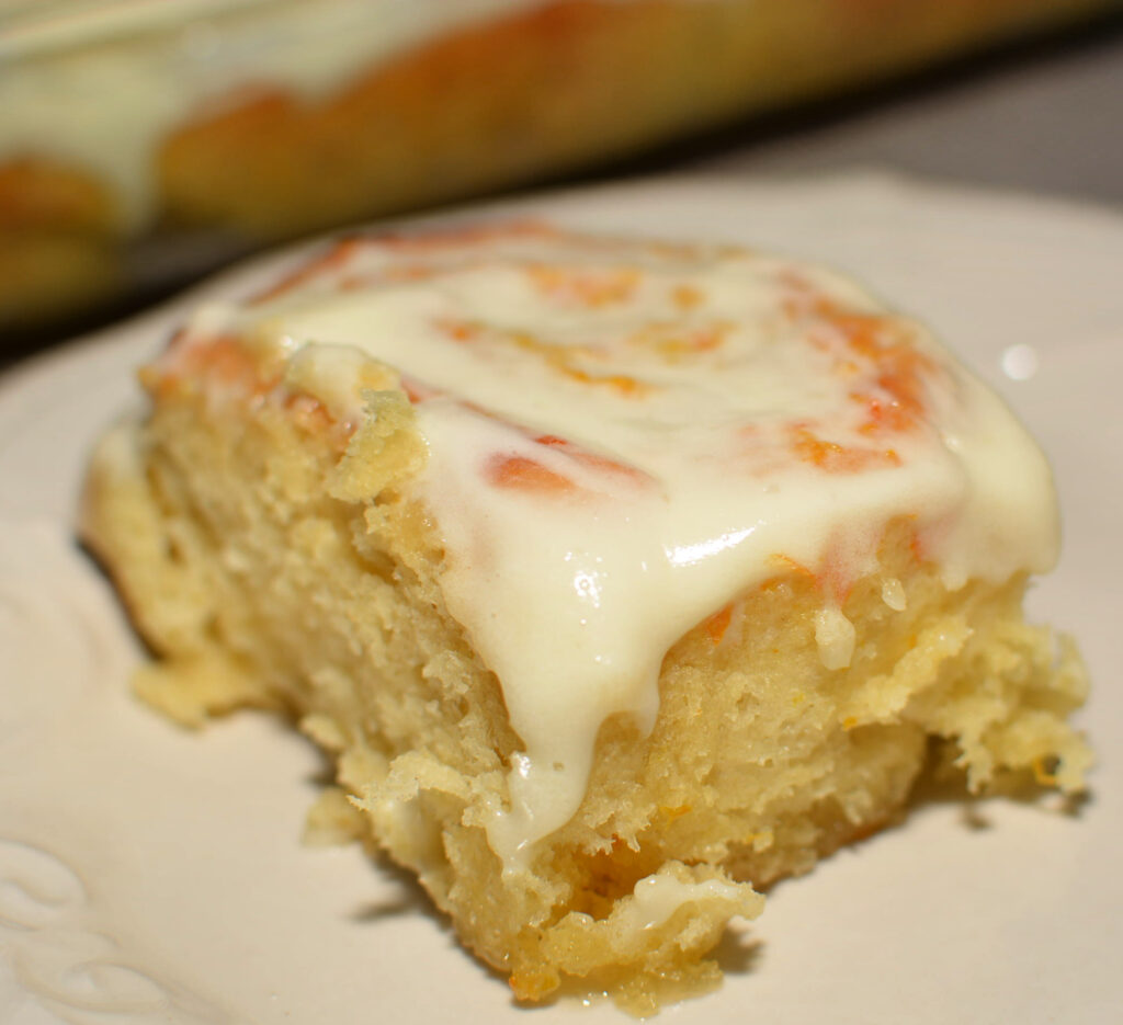 ooey gooey, fluffy orange rolls with a creamy frosting on top