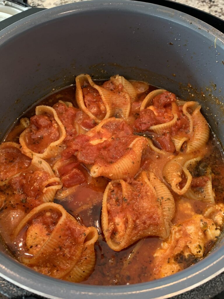 Stuffed shells with spaghetti sauce on top, cooked in the Instant Pot