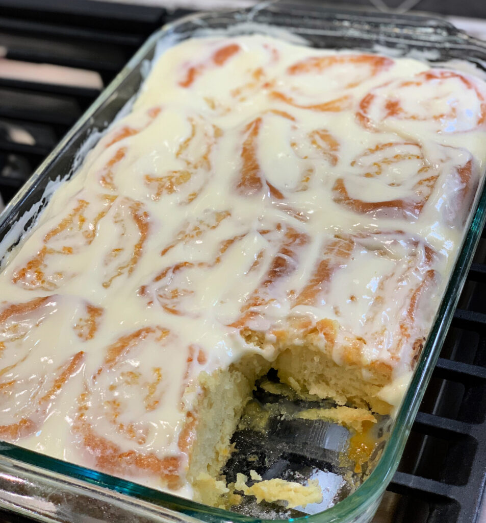 homemade orange rolls frosted with a cream cheese icing