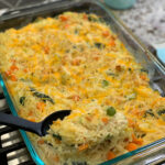 Shredded chicken, tender rice, and mixed veggies combined in a flavorful casserole