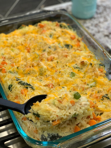 Shredded chicken, tender rice, and mixed veggies combined in a flavorful casserole