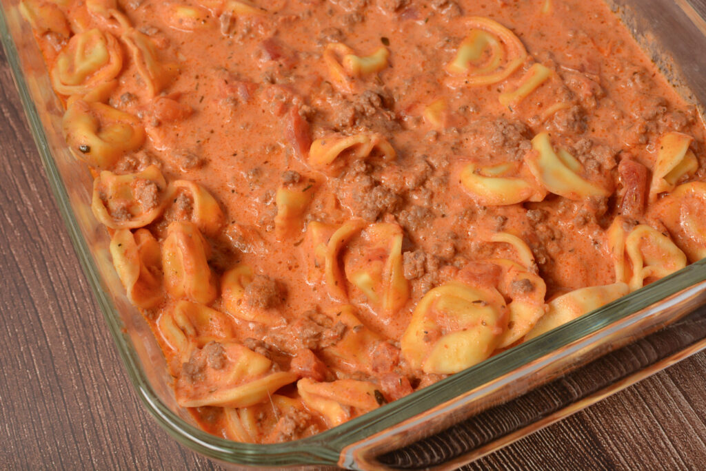 cheesy filled tortellini with a cream cheese pasta sauce on top