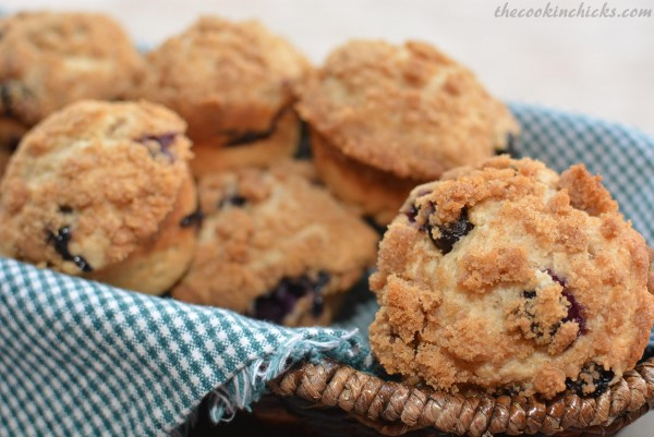 blueberry muffins lined in a cloth basket.