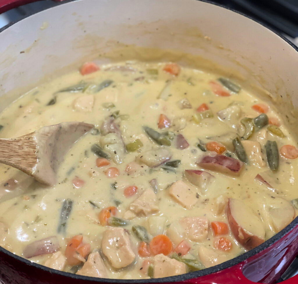 creamy chicken stew packed with flavor and cooked in a Dutch oven