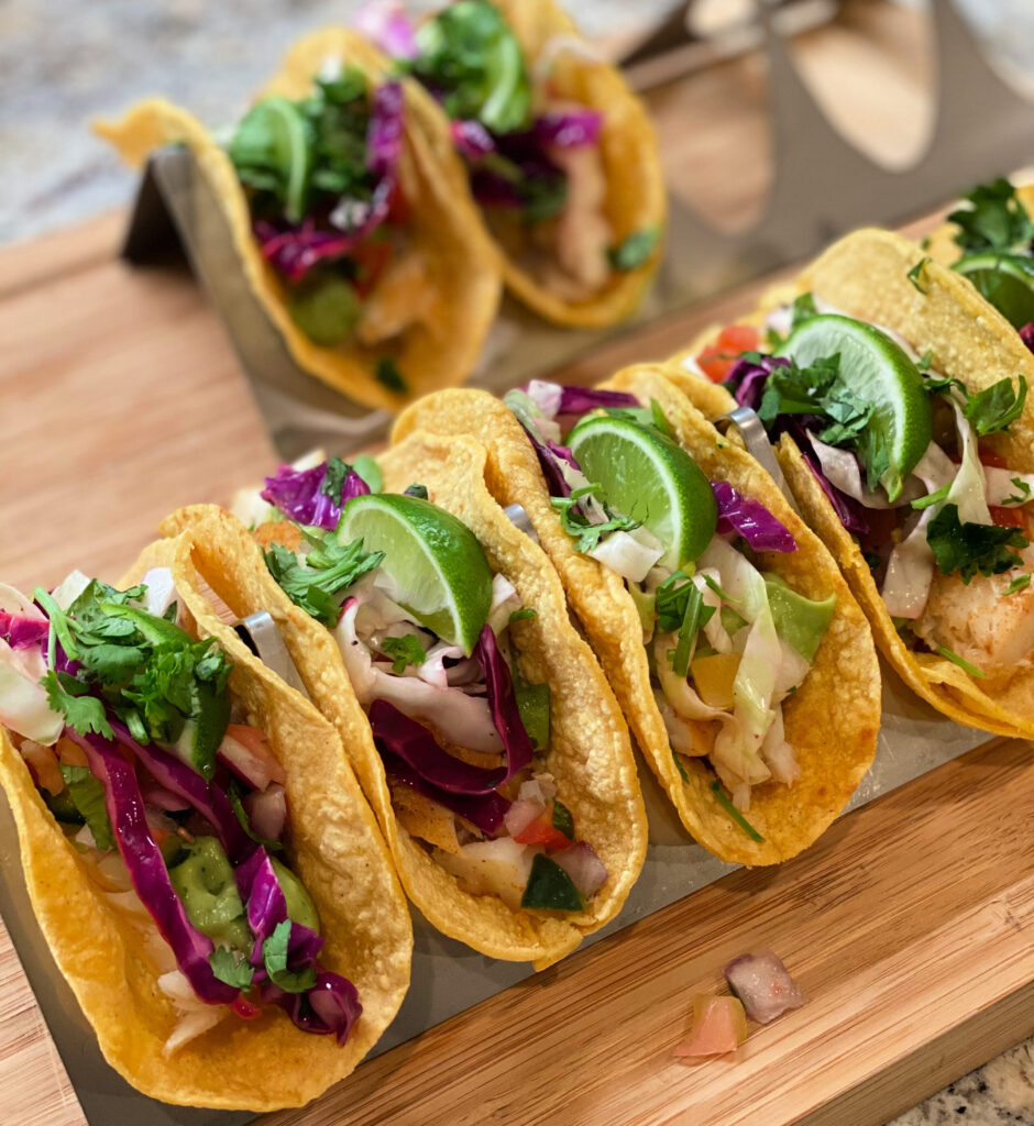 flaky fish, a crispy slaw, and sauce combined into fish tacos