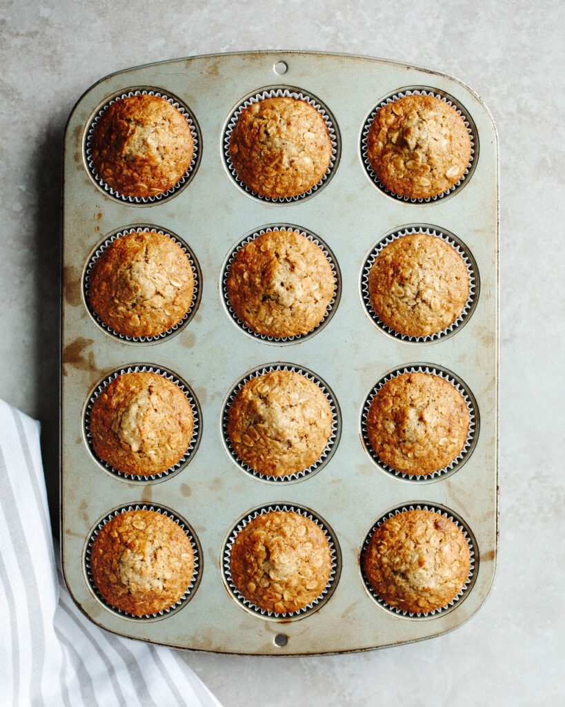 a muffin tray with maple brown sugar oatmeal muffins baked.
