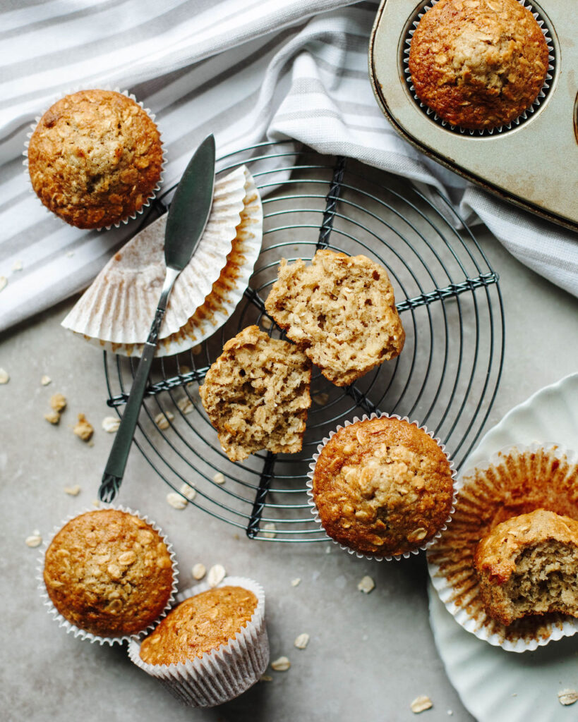 hearty oat muffins on a wire rack.