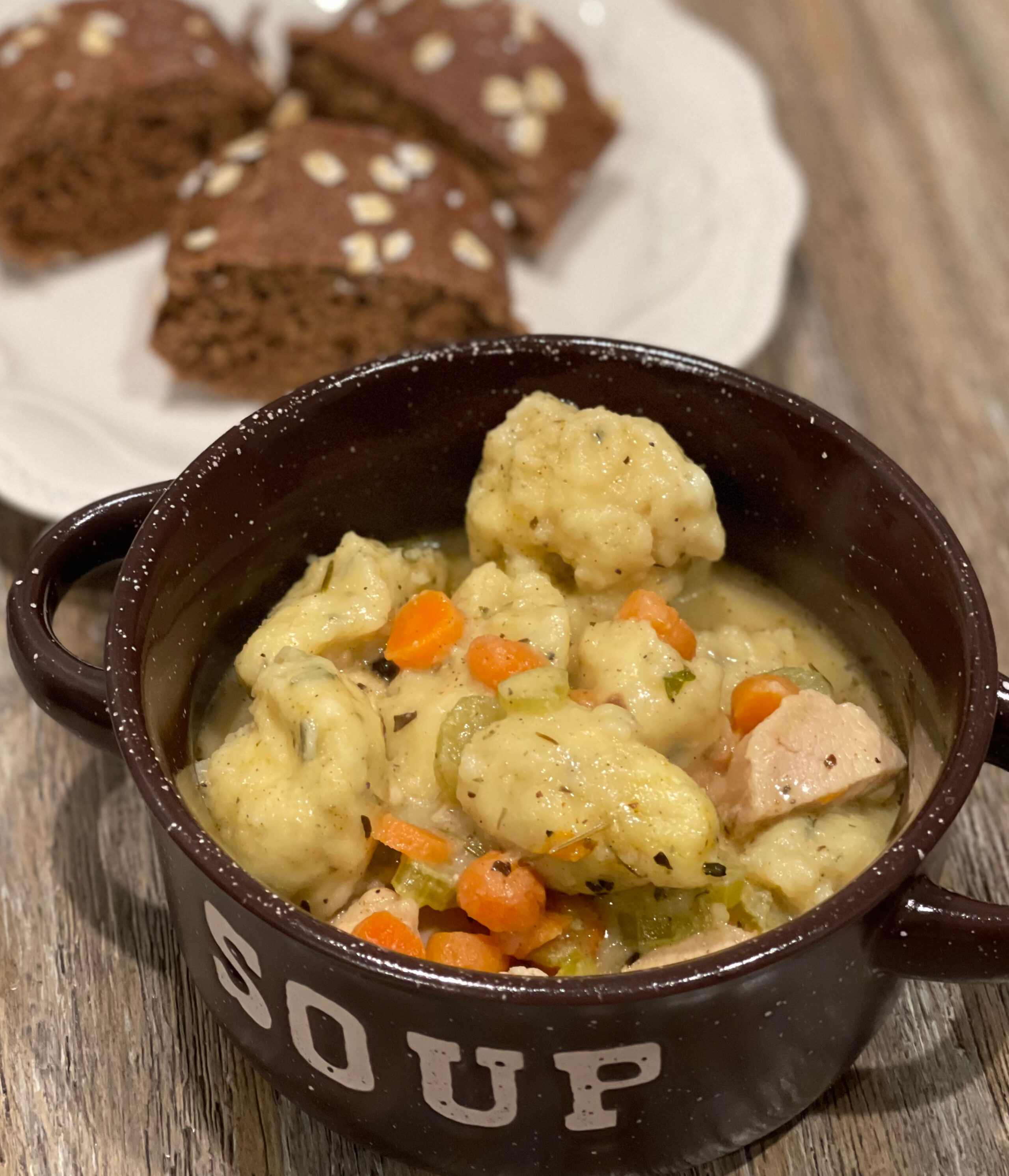 a bowl of chicken and dumplings.