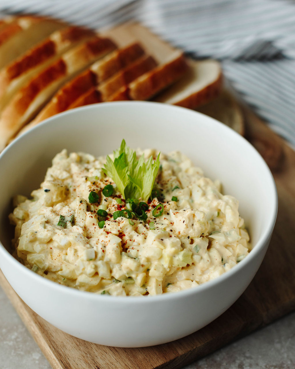 egg salad in a white bowl for sandwiches.