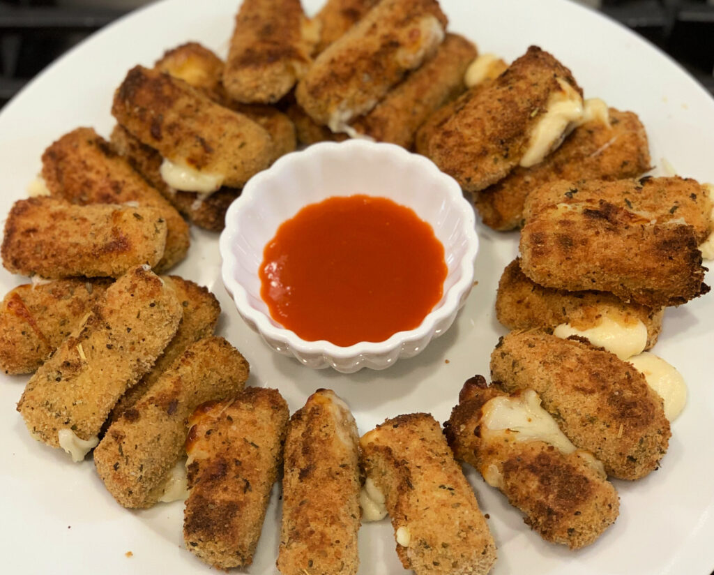 breaded cheese sticks seasoned and made crispy using the air fryer