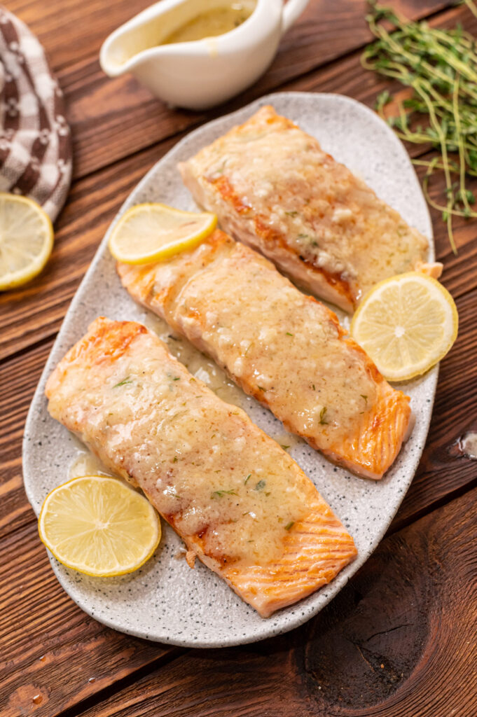 tender, flaky salmon served with lemon wedges 