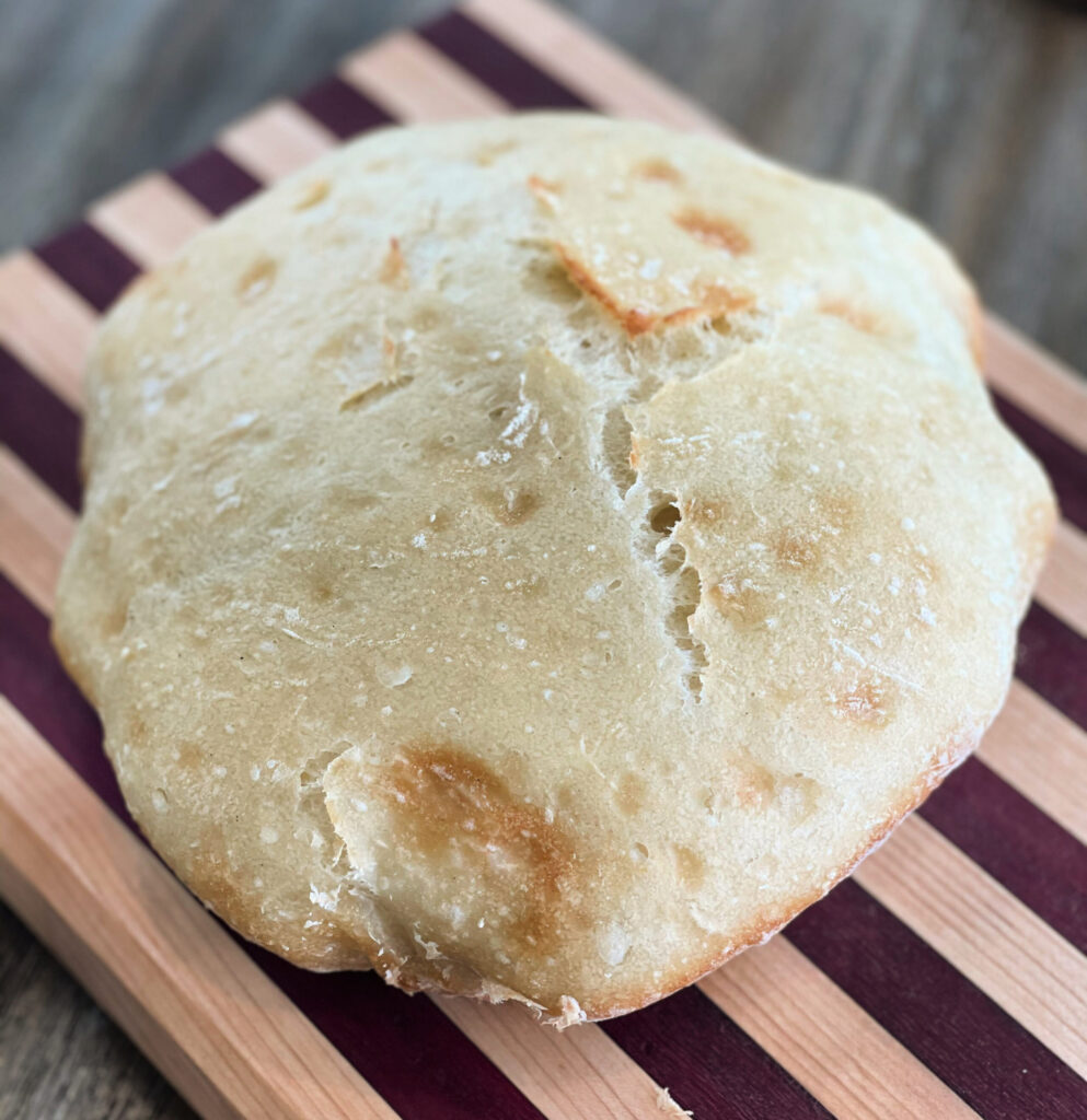 a loaf of homemade crusty bread made with only 4 ingredients