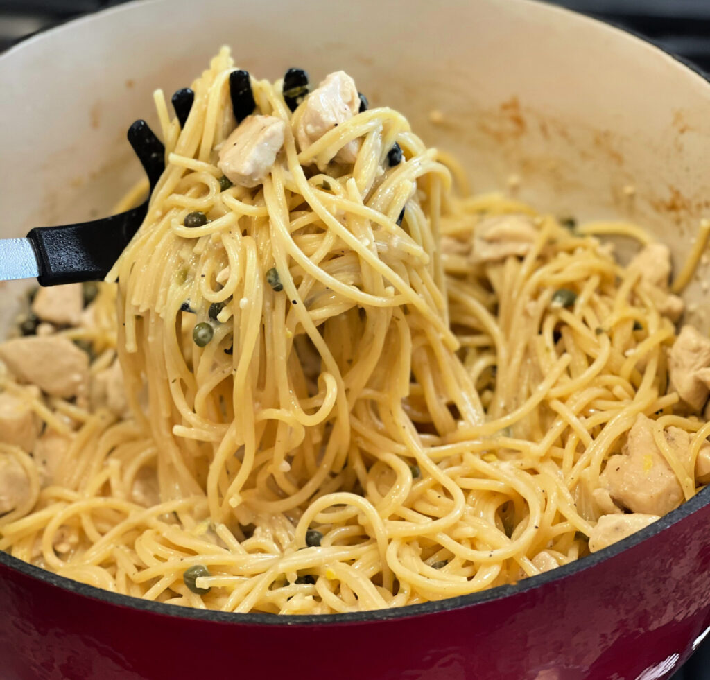 lemon sauce over pasta with chicken throughout