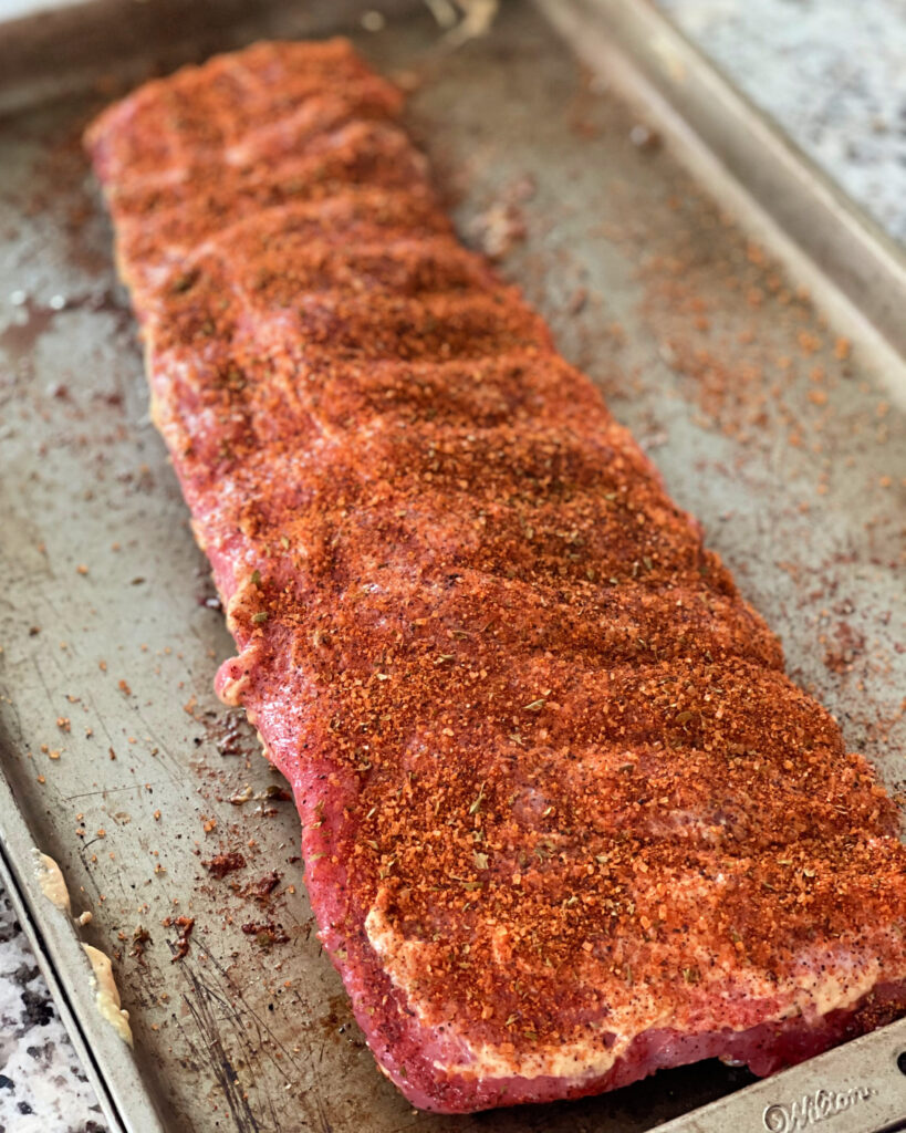 baby back ribs seasoned and ready to put on the smoker