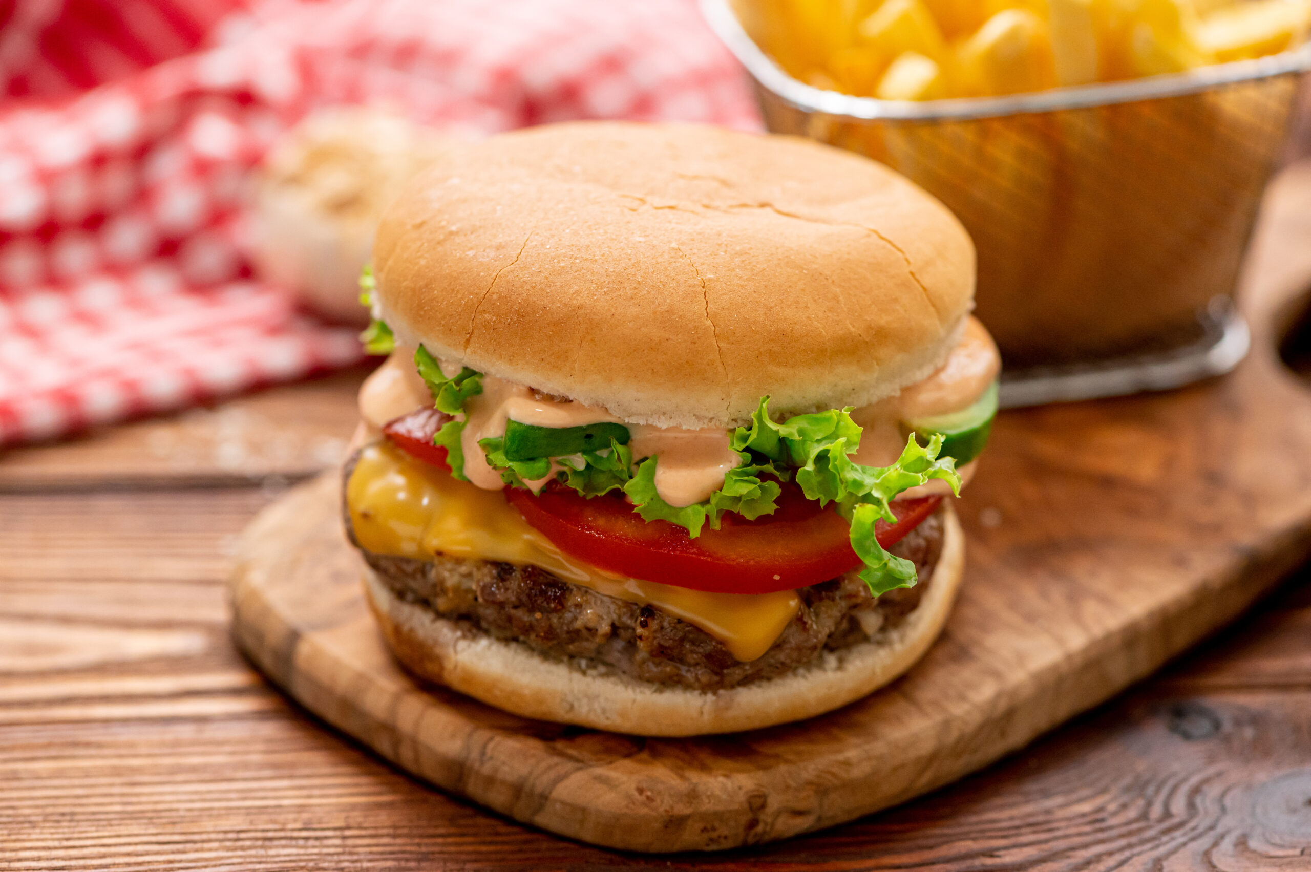 a juicy homemade hamburger loaded with toppings.