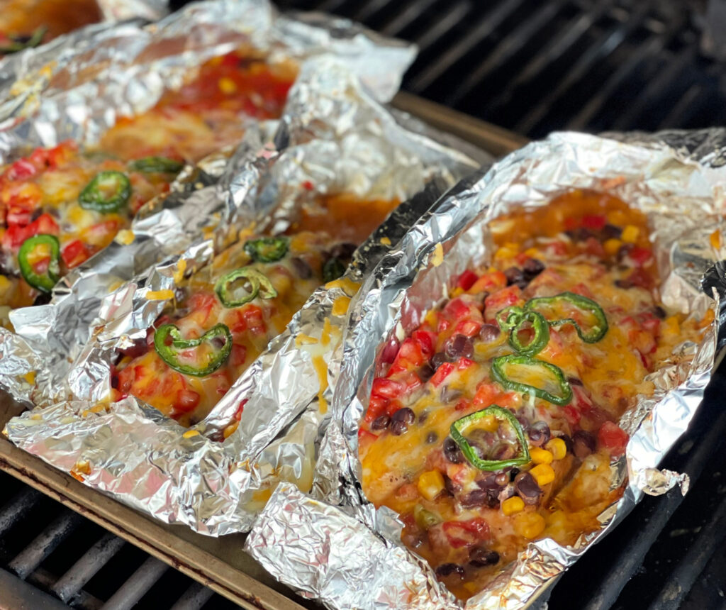 cooked chicken foil packets ready to be eaten