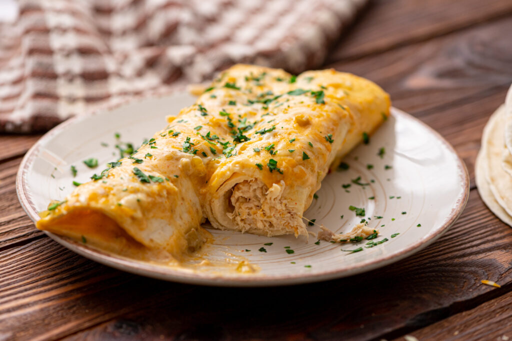 creamy enchiladas filled with chicken and cheese