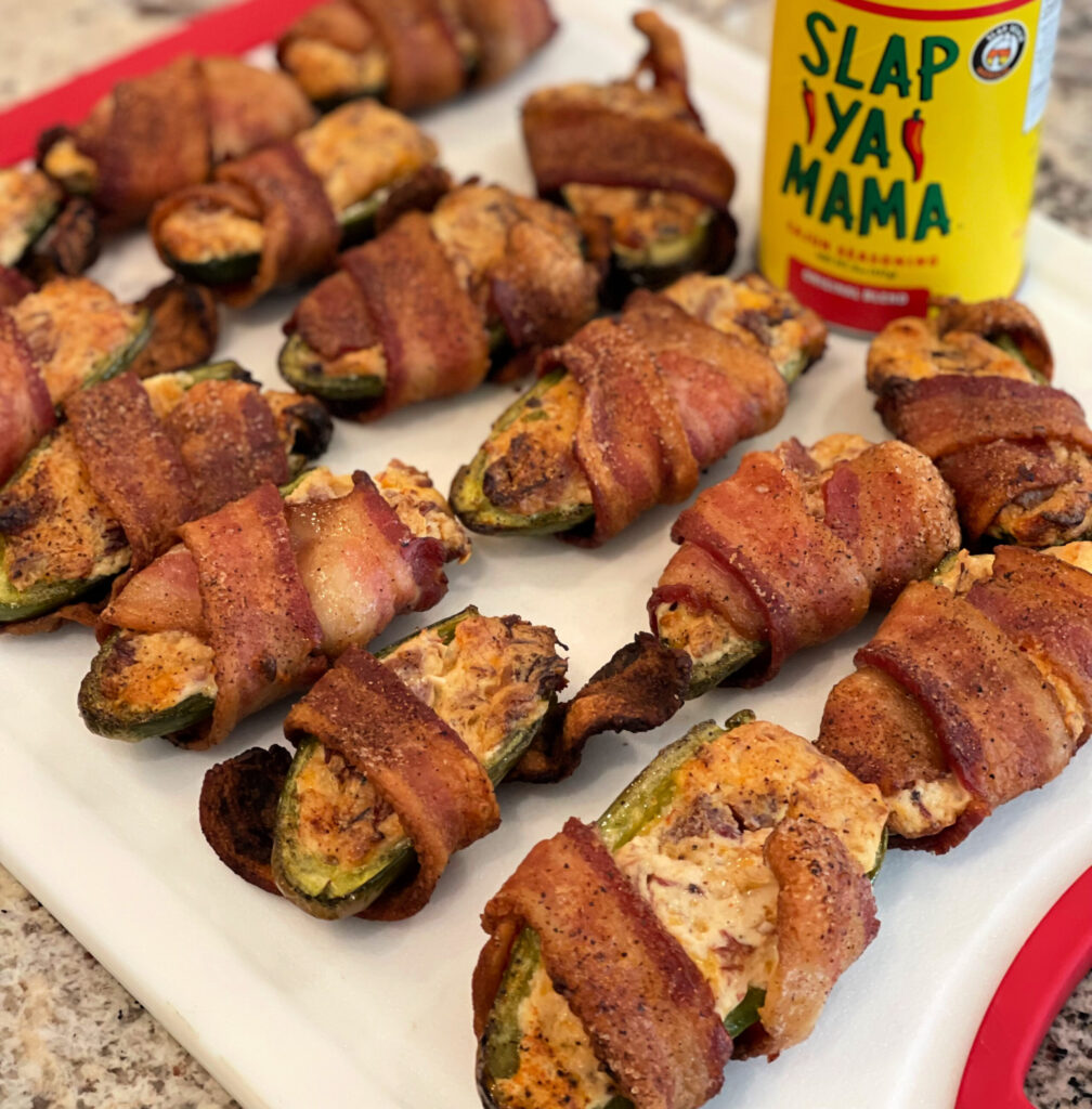 bacon wrapped stuffed jalapenos cooked on the grill or smoker