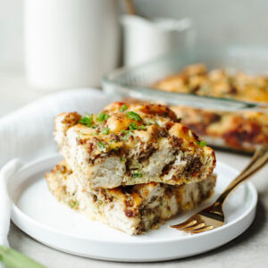cooked pieces of frozen biscuit breakfast bake on a white plate.