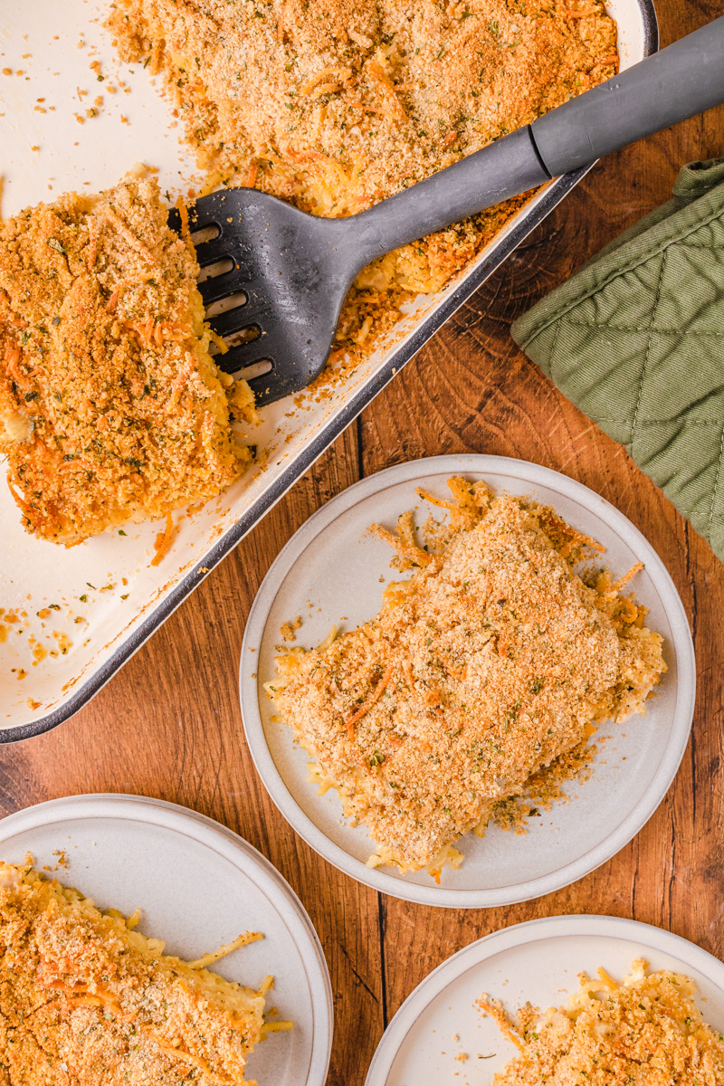 cheesy chicken spaghetti served on a white plate.