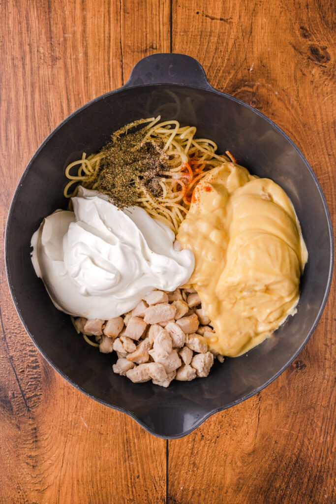 all the ingredients needed to make the creamy chicken sauce when combining with pasta.