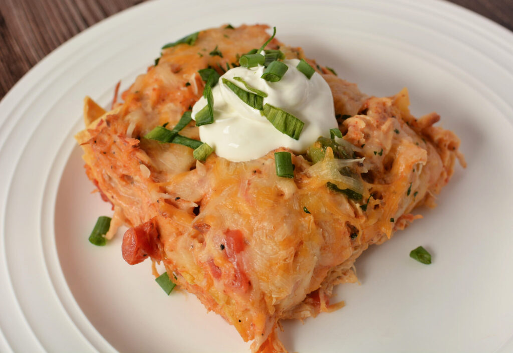 a piece of rotel king ranch chicken casserole on a plate