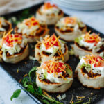 Mexican roll ups with favorite toppings added and ready to serve.