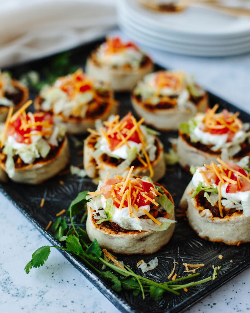 Mexican roll ups with favorite toppings added and ready to serve.