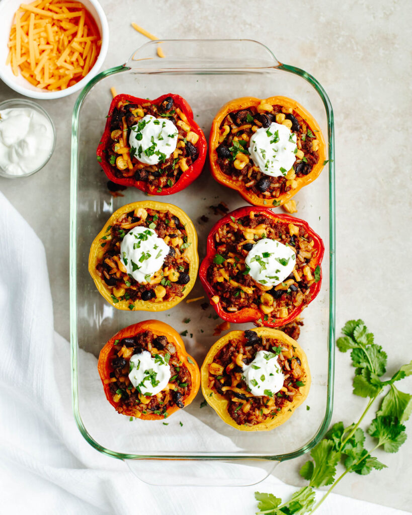 Taco Stuffed Peppers in a glass baking pan.