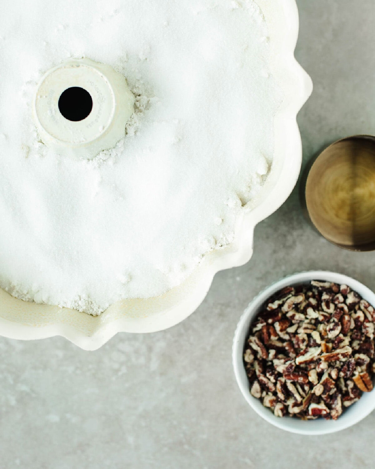 sugar sprinkled on top of Bisquick baking mix in a bundt pan.