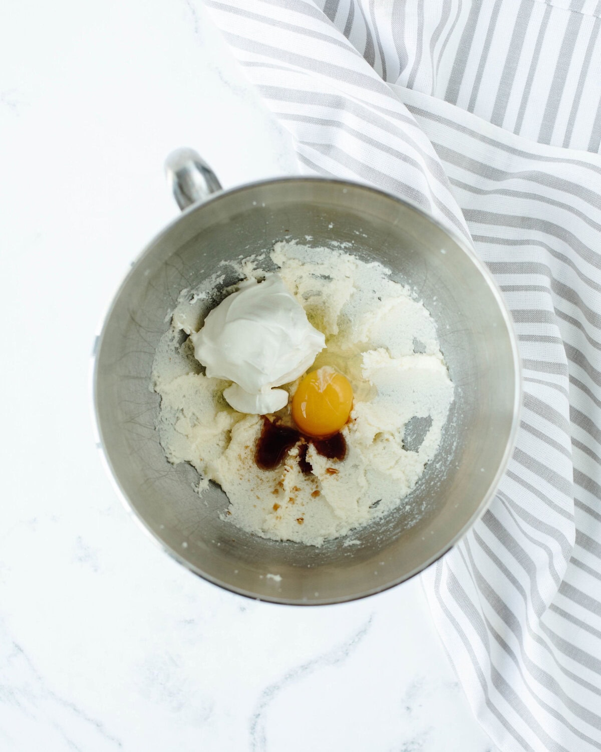 wet ingredients folded into a creamed butter mixture to make a cake.