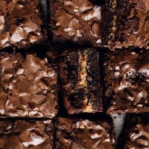 an up close look at fudgy brownies with marshmallow and graham crackers in them.