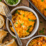 cheesy chicken bake served in bowls with bread