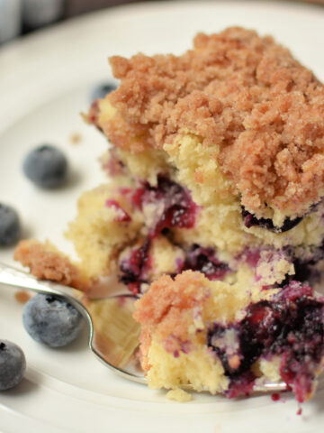 an up close look at a piece of blueberry brunch cake