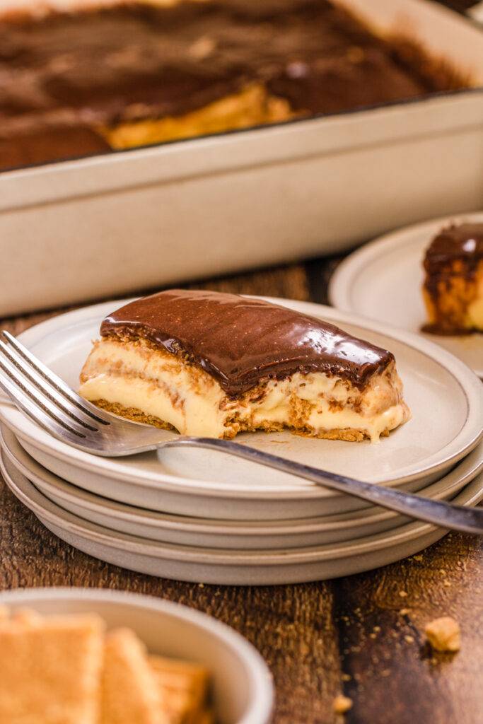no bake chocolate eclair cake served on a plate