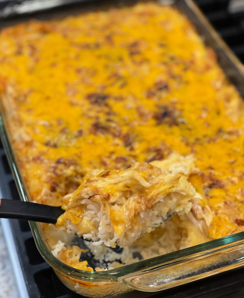 cheesy chicken casserole with layers of rice, chicken, and cheese