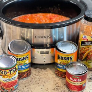 beef and onions combined in a tex mex broth served over frito corn chips