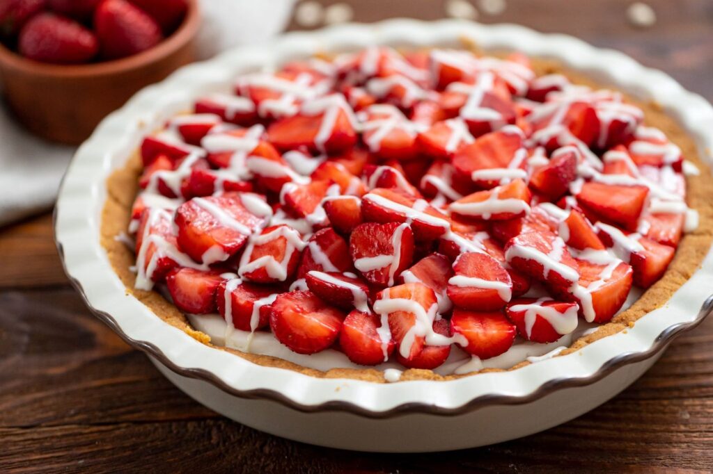 flavorful strawberry pie with white chocolate drizzled on top