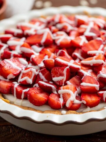 flavorful strawberry pie with white chocolate drizzled on top