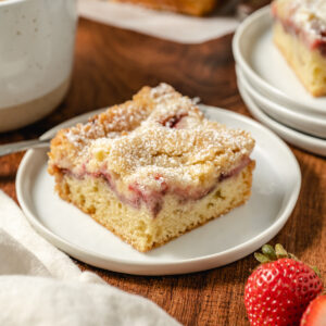 a slice of strawberry crumb coffee cake on a plate