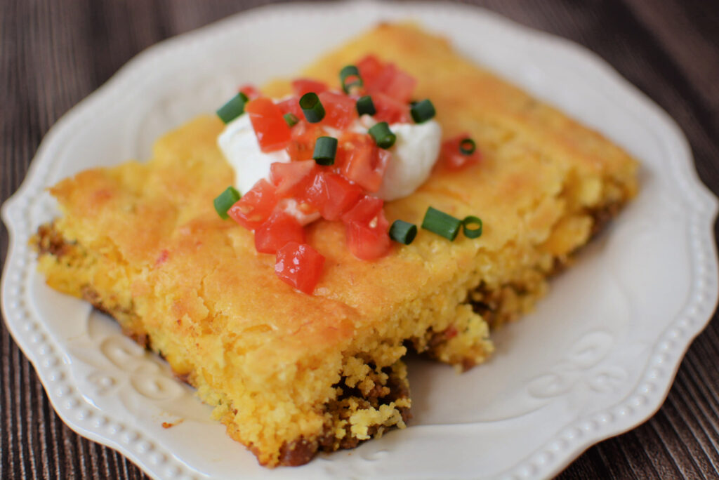 a piece of jiffy taco cornbread casserole served on a plate