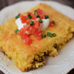 a piece of jiffy taco cornbread casserole served on a plate