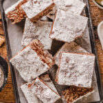 a crunchy cereal bar coated with chocolate, peanut butter, and powdered sugar.
